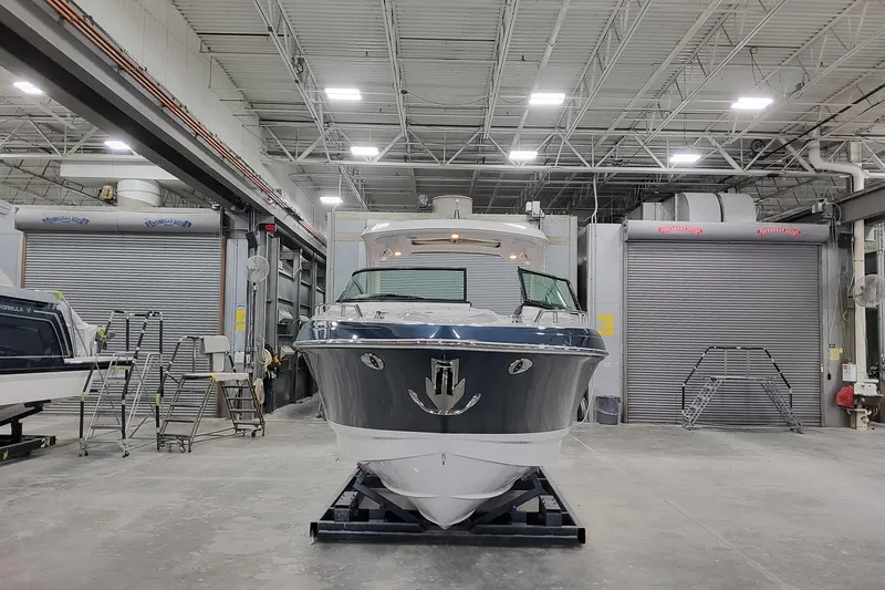  Yacht Photos Pics 2026 Formula 330 Crossover Bowrider OB in a spacious indoor facility.