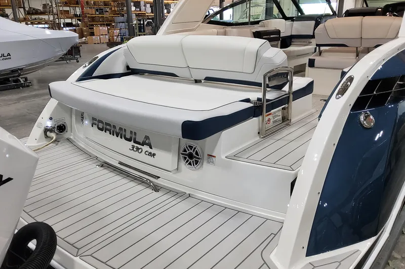 Yacht Photos Pics 2026 Formula 330 Crossover Bowrider OB, luxury boat interior with seating, in a showroom.