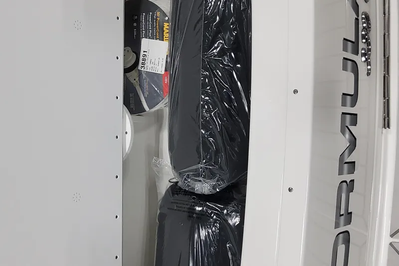  Yacht Photos Pics 2026 Formula 330 Crossover Bowrider OB storage compartment with packaged items and visible branding.