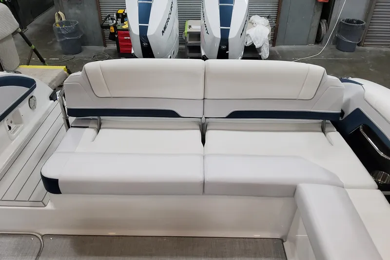 Yacht Photos Pics 2026 Formula 330 Crossover Bowrider OB interior seating with white and blue upholstery.