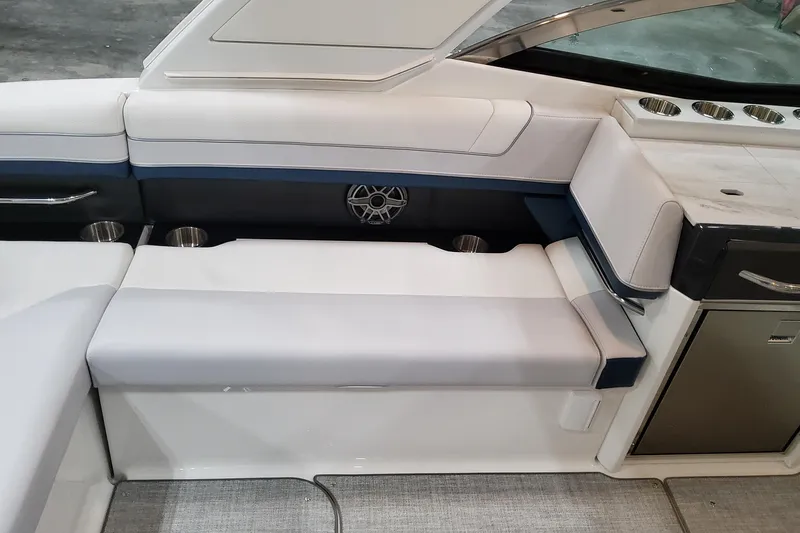  Yacht Photos Pics 2026 Formula 330 Crossover Bowrider OB interior seating with cup holders and sleek design.