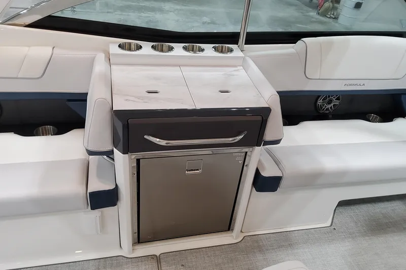  Yacht Photos Pics 2026 Formula 330 Crossover Bowrider OB interior with seating, cup holders, and storage.