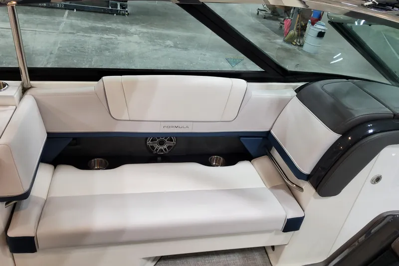  Yacht Photos Pics 2026 Formula 330 Crossover Bowrider OB interior seating with cup holders and speaker.