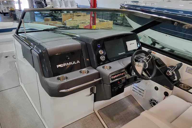  Yacht Photos Pics 2026 Formula 330 Crossover Bowrider OB cockpit with modern controls and navigation system.