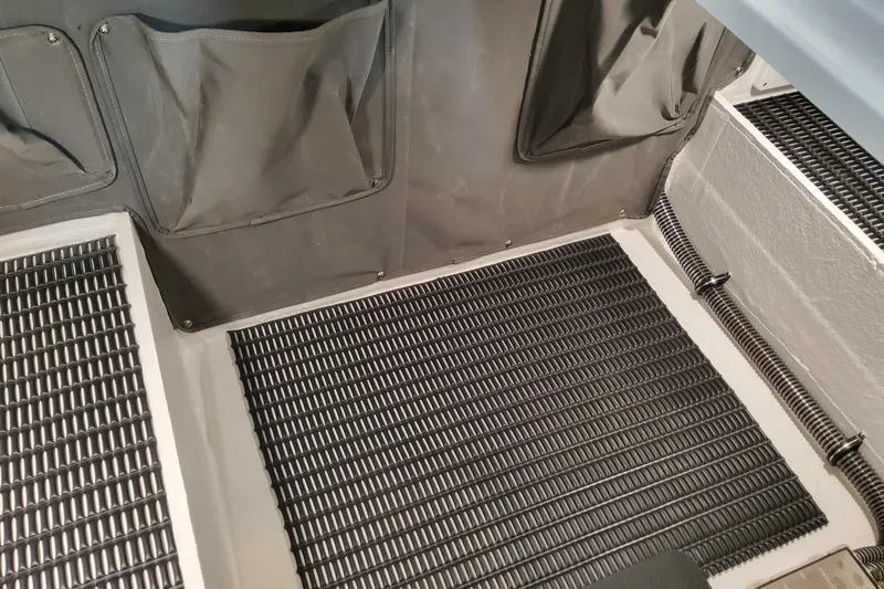  Yacht Photos Pics 2026 Formula 330 Crossover Bowrider OB interior with textured flooring and storage pockets.