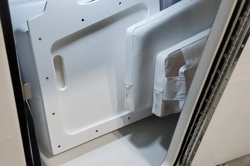  Yacht Photos Pics 2026 Formula 330 Crossover Bowrider OB interior storage compartment with white cushions.