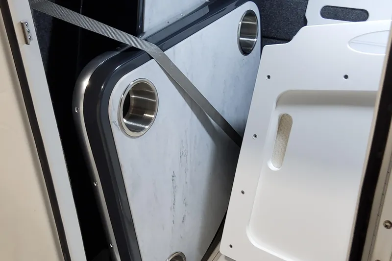  Yacht Photos Pics 2026 Formula 330 Crossover Bowrider OB interior storage with secured table and cup holders.