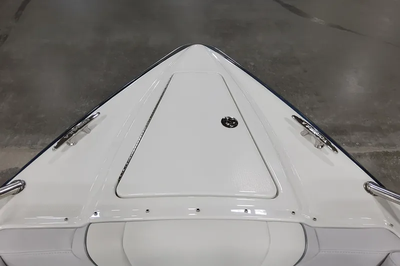  Yacht Photos Pics 2026 Formula 330 Crossover Bowrider OB, sleek white bow design, docked indoors.