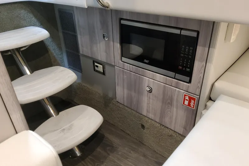  Yacht Photos Pics Interior of 2026 Formula 330 Crossover Bowrider OB with microwave and stairs.