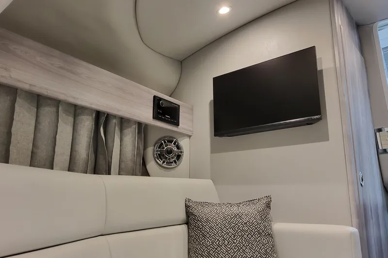  Yacht Photos Pics Interior of 2026 Formula 330 Crossover Bowrider OB with TV and speaker system.
