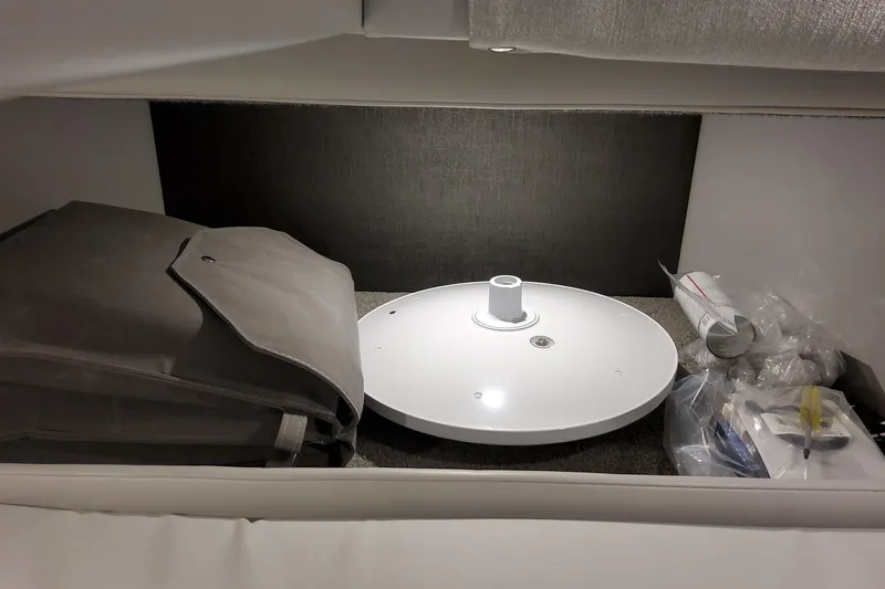  Yacht Photos Pics Storage compartment in 2026 Formula 330 Crossover Bowrider OB with various items.