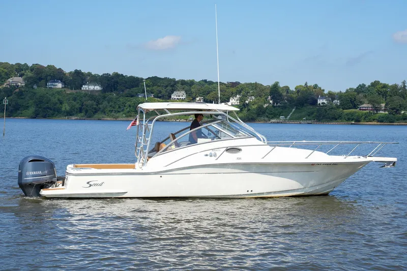  Yacht Photos Pics 2008 Scout 295 Abaco boat on calm water with Yamaha engine, scenic background.