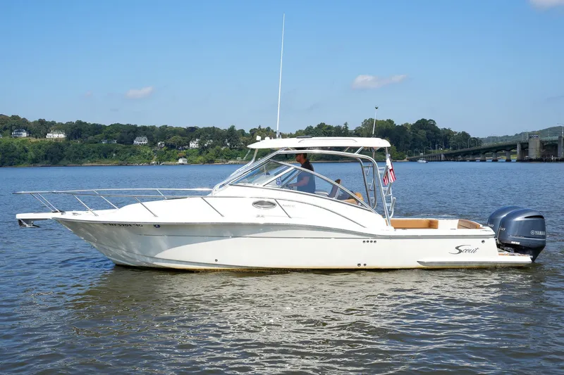  Yacht Photos Pics 2008 Scout 295 Abaco boat on calm water with scenic background.