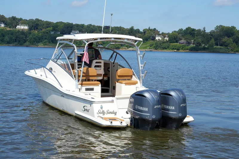  Yacht Photos Pics 2008 Scout 295 Abaco boat with twin Yamaha engines on a calm lake.