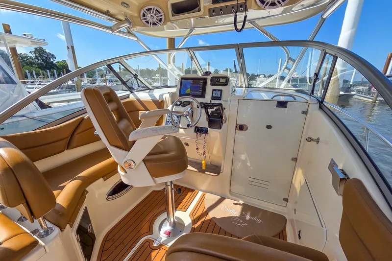  Yacht Photos Pics Luxurious 2008 Scout 295 Abaco boat interior with leather seating and modern controls.