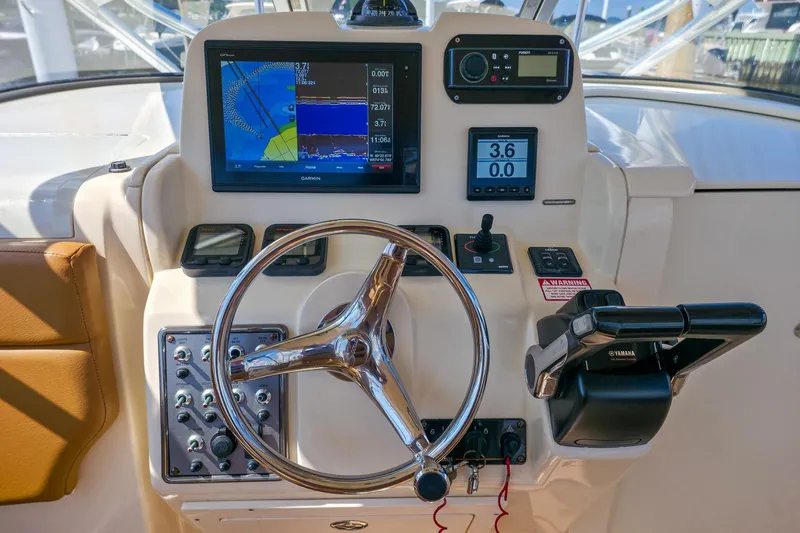  Yacht Photos Pics 2008 Scout 295 Abaco boat dashboard with Garmin navigation system and Yamaha controls.