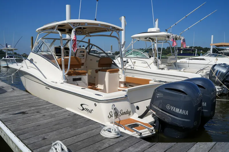  Yacht Photos Pics 2008 Scout 295 Abaco boat docked with Yamaha engines, featuring a sleek design and American flags.