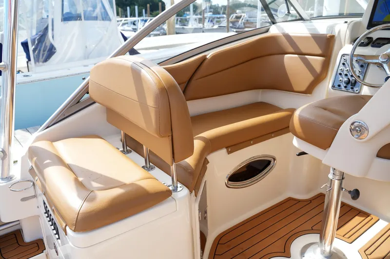  Yacht Photos Pics 2008 Scout 295 Abaco boat interior with tan leather seating and wooden flooring.