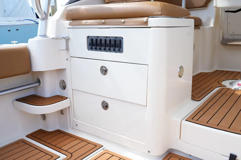  Yacht Photos Pics 2008 Scout 295 Abaco boat interior with storage drawers and teak flooring.