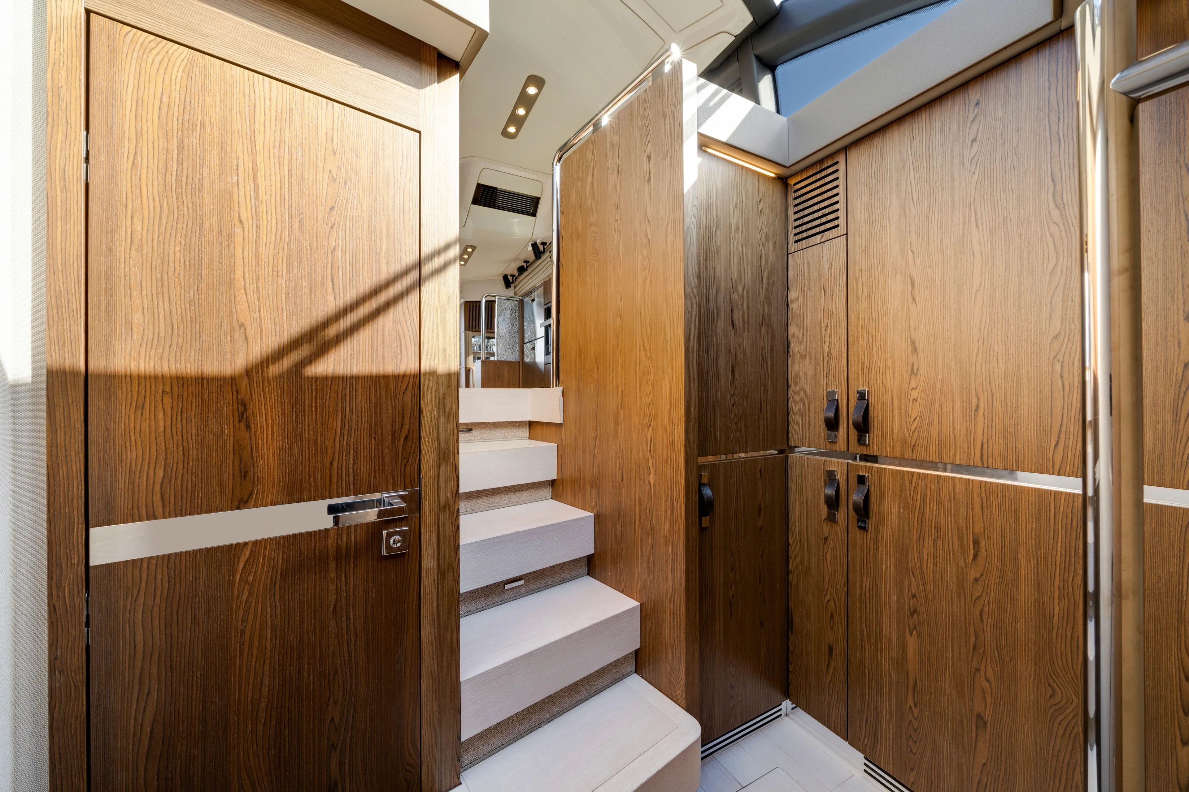 Our Trade Yacht Photos Pics Interior of 2018 Azimut 50 Fly yacht with wooden cabinetry and stairs.
