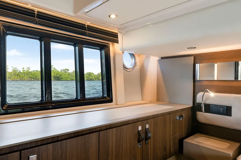 Our Trade Yacht Photos Pics Luxurious interior of 2018 Azimut 50 Fly yacht with scenic water view.