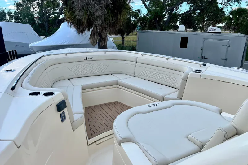  Yacht Photos Pics 2023 Scout 330 LXF boat interior with luxurious seating and elegant design.