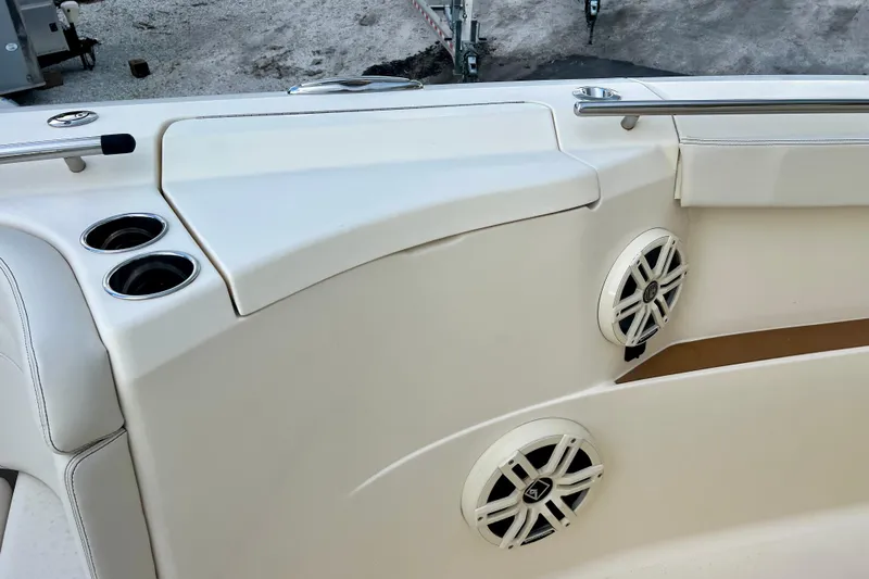  Yacht Photos Pics 2023 Scout 330 LXF boat interior with cup holders and speakers.