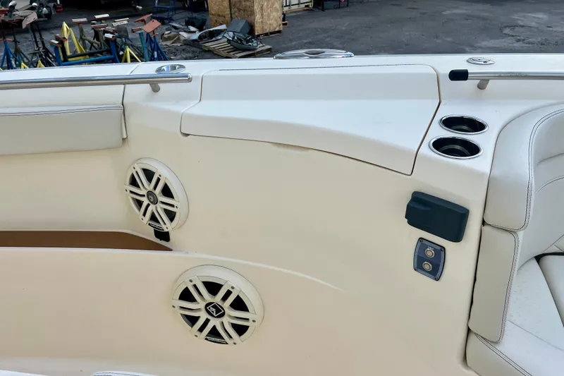  Yacht Photos Pics 2023 Scout 330 LXF boat interior with speakers and cup holders.