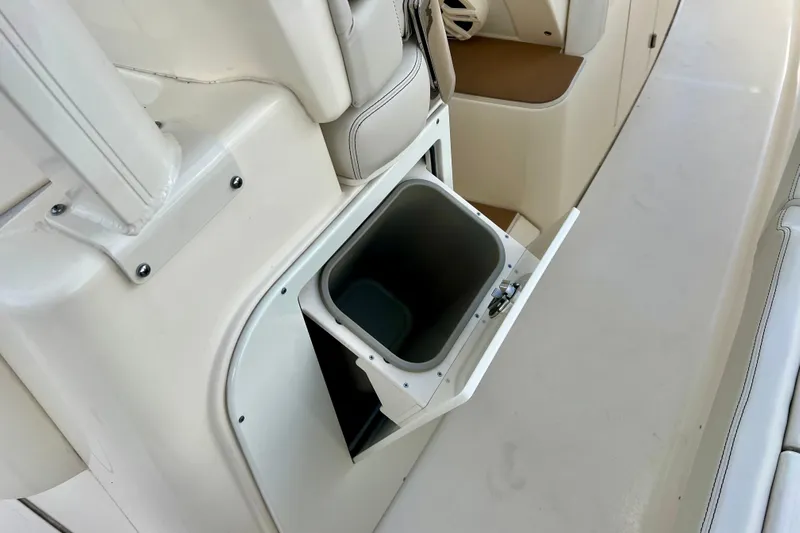  Yacht Photos Pics 2023 Scout 330 LXF boat interior with built-in storage compartment.