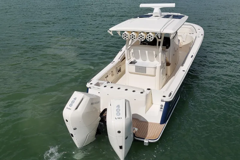  Yacht Photos Pics 2023 Scout 330 LXF boat with dual Mercury engines on open water.