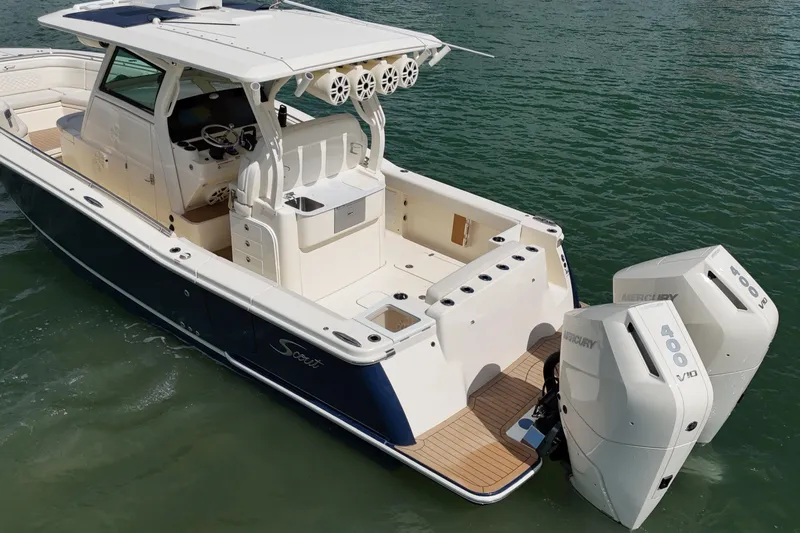  Yacht Photos Pics 2023 Scout 330 LXF boat with dual Mercury 400 engines on water.