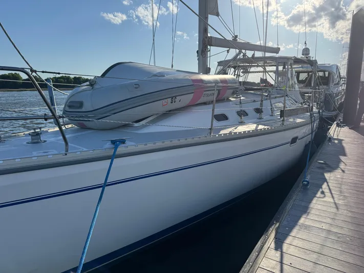 Shenanigans Yacht Photos Pics Catalina 400 MkII 2001 sailboat docked with inflatable dinghy on deck.