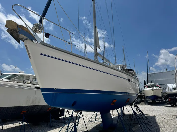 Shenanigans Yacht Photos Pics Catalina 400 MkII 2001 sailboat on stands, clear sky background.