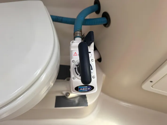 Shenanigans Yacht Photos Pics Jabsco marine toilet pump in a 2001 Catalina 400 MkII yacht bathroom.