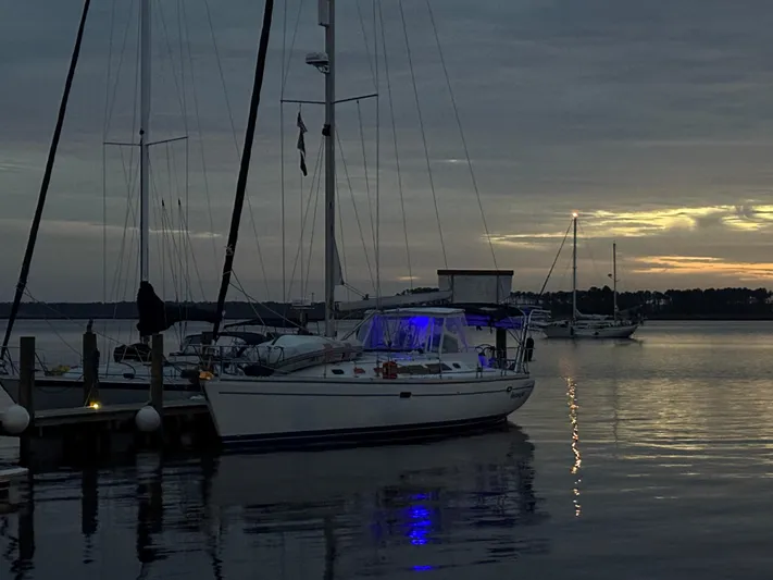 Shenanigans Yacht Photos Pics Sailboat Catalina 400 MkII 2001 docked at sunset with glowing blue lights.