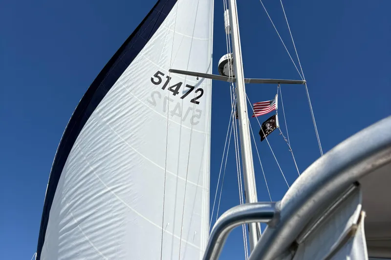 Shenanigans Yacht Photos Pics Sailboat Catalina 400 MkII 2001 with American flag, clear blue sky background.