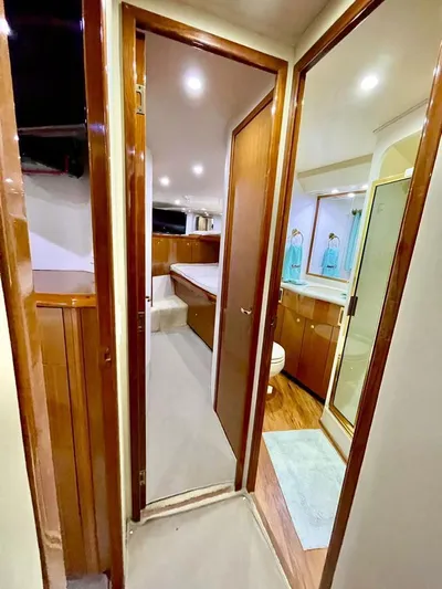 Ayayaiii Yacht Photos Pics Interior of 2003 Viking 52 Convertible yacht with bedroom and bathroom.