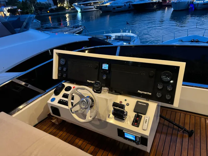 My Biscane Yacht Photos Pics Cockpit of 2007 Astondoa A 76 GLX yacht with advanced navigation controls at marina.