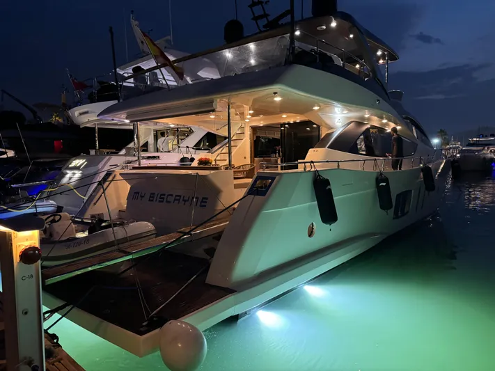 My Biscane Yacht Photos Pics Luxurious 2007 Astondoa A 76 GLX yacht illuminated at night in marina.