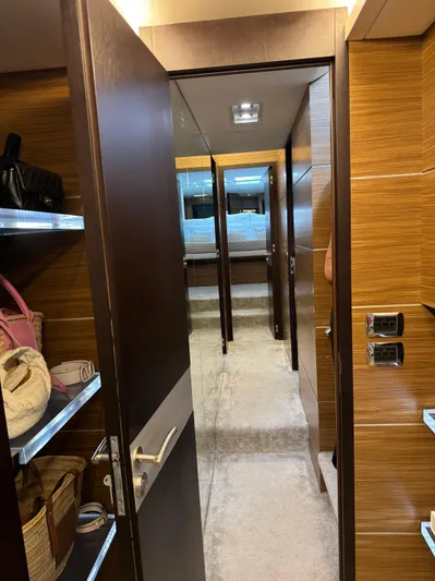 My Biscane Yacht Photos Pics Interior hallway of 2007 Astondoa A 76 GLX yacht with wooden finishes and shelving.