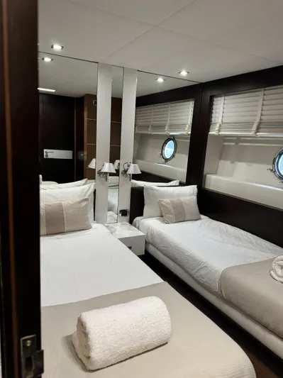 My Biscane Yacht Photos Pics Luxurious cabin interior of 2007 Astondoa A 76 GLX yacht with twin beds and porthole windows.