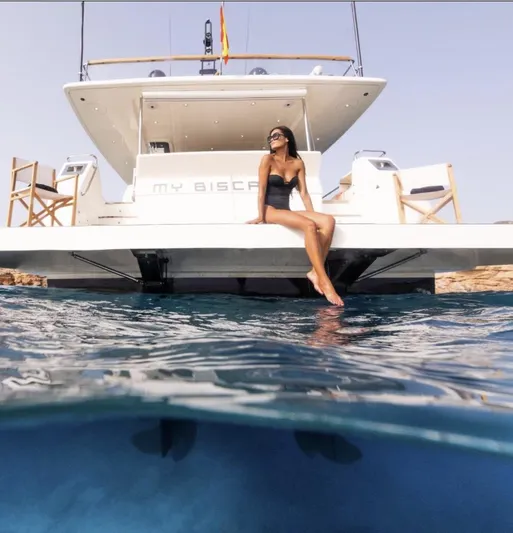 My Biscane Yacht Photos Pics Woman relaxing on 2007 Astondoa A 76 GLX yacht, enjoying sunny day at sea.