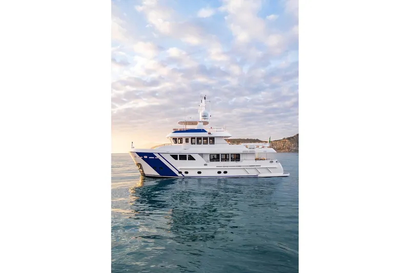 Empire Yacht Photos Pics 2024 Cantiere Delle Marche Darwin 86 yacht on calm sea at sunset.