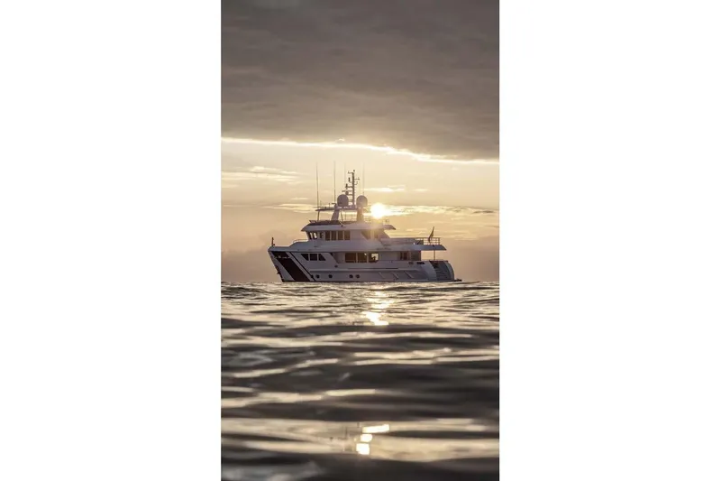 Empire Yacht Photos Pics 2024 Cantiere Delle Marche Darwin 86 yacht at sunset on calm sea.