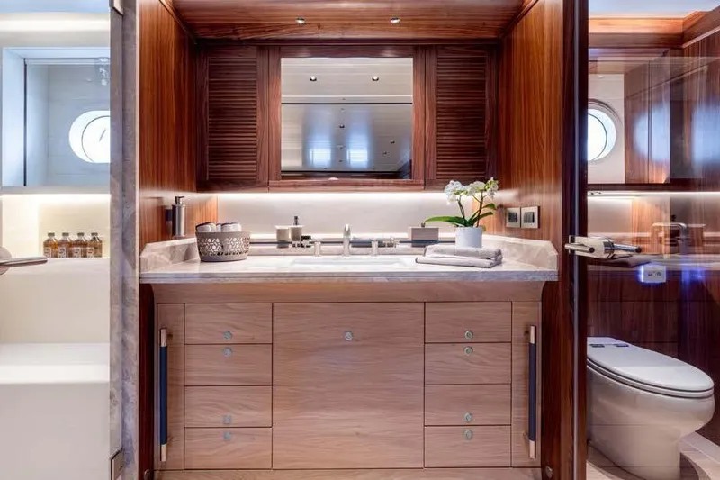 Empire Yacht Photos Pics Luxurious 2024 Cantiere Delle Marche Darwin 86 yacht bathroom with elegant wood finishes.