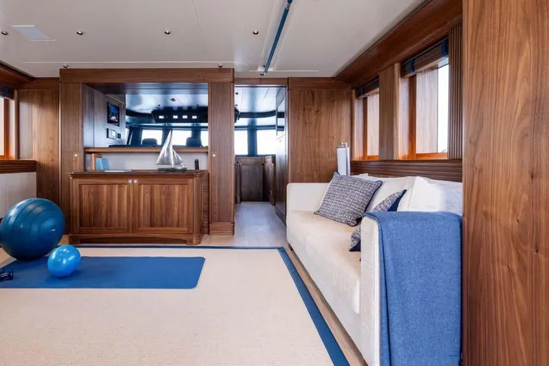 Empire Yacht Photos Pics Luxurious interior of 2024 Cantiere Delle Marche Darwin 86 yacht with elegant wood finish.