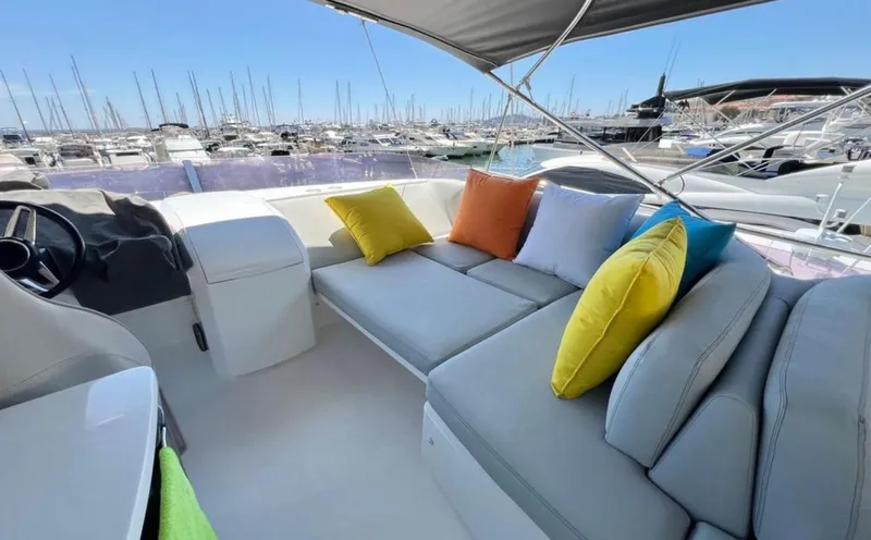  Yacht Photos Pics Luxurious 2016 Princess yacht with colorful cushions, docked at a marina under clear blue skies.