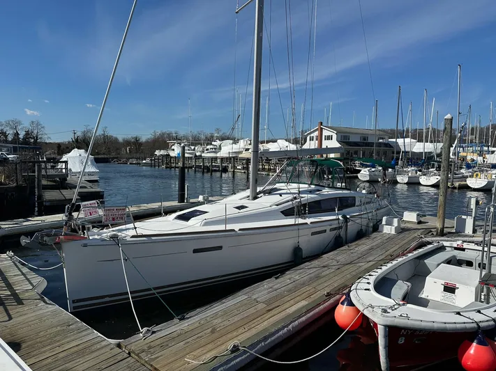 Life Line Yacht Photos Pics 2017 Jeanneau Sun Odyssey 44 DS sailboat docked at a marina under clear blue skies.