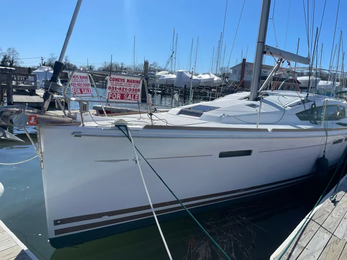 Life Line Yacht Photos Pics 2017 Jeanneau Sun Odyssey 44 DS sailboat docked, with "For Sale" signs displayed.