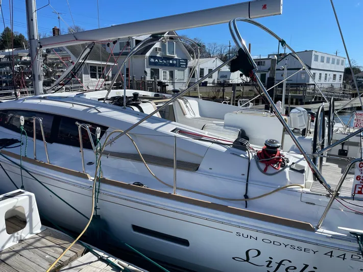 Life Line Yacht Photos Pics 2017 Jeanneau Sun Odyssey 44 DS sailboat docked at a marina.